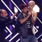 Eurovision SuRie’s stage stormed Surie on stage