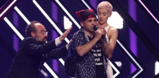 Eurovision SuRie’s stage stormed Surie on stage