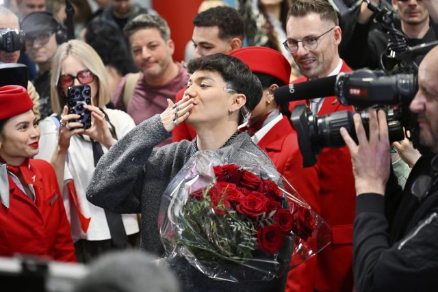 IMG_2396 Photo: The Canadian Press JJ, center, from Austria arrives at the airport in Vienna, Austria, Sunday, May 18, 2025, after winning the Grand Final of the 69th Eurovision Song Contest, in Basel yesterday.
