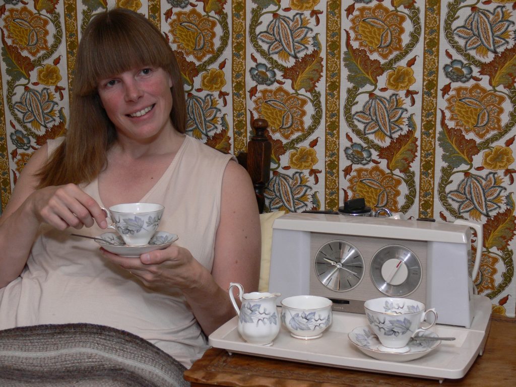 Nick “does” 2025 – Spain An attractive woman with some attractive wallpaper and an attractive teasmade.