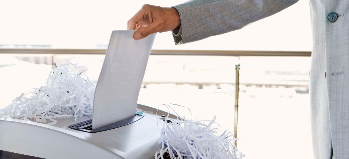 Vote going through a paper shredder